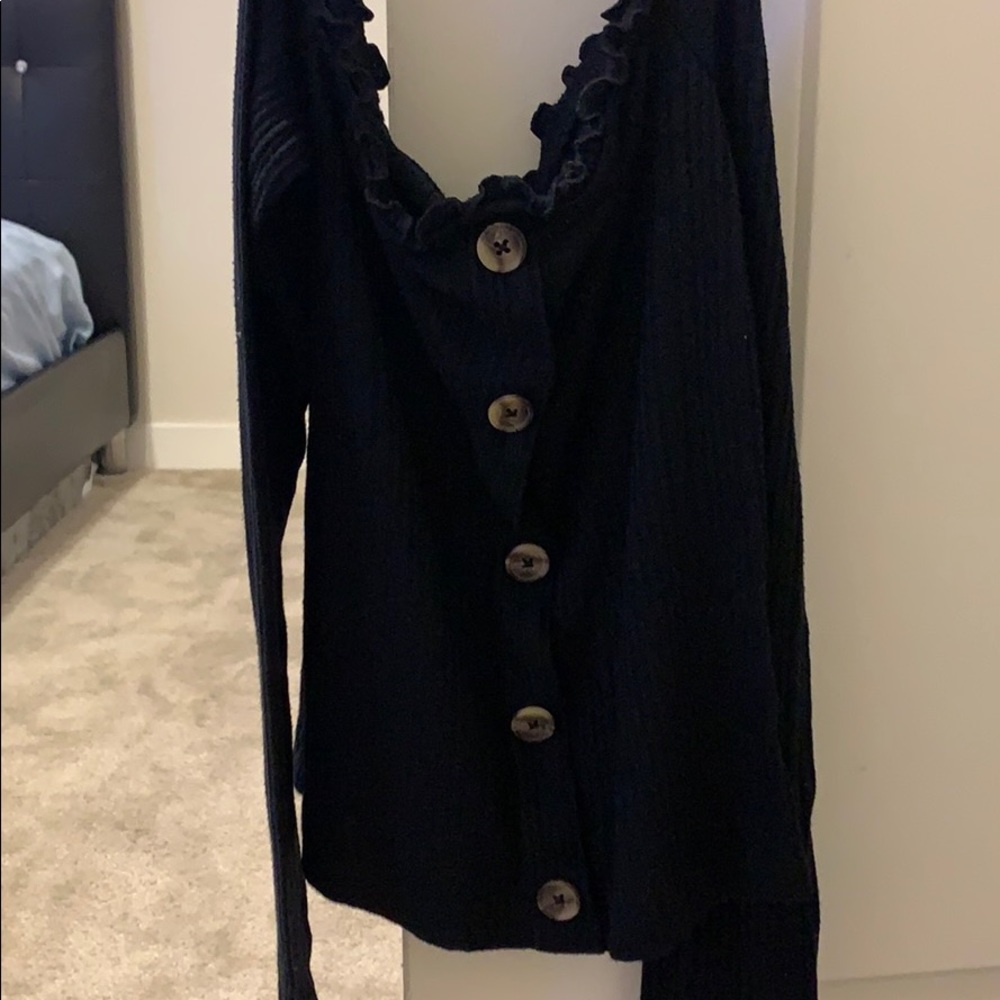 A black off the shoulder shirt